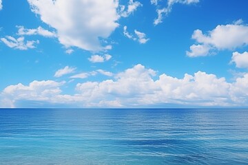 Azure Panorama: White Clouds Drifting Over Turquoise Ocean and Blue Sky
