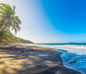 Dark shore in Grande Anse beach in Guadeloupe