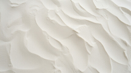 Top view of white sand, captured in close-up detail, displaying textured grains.