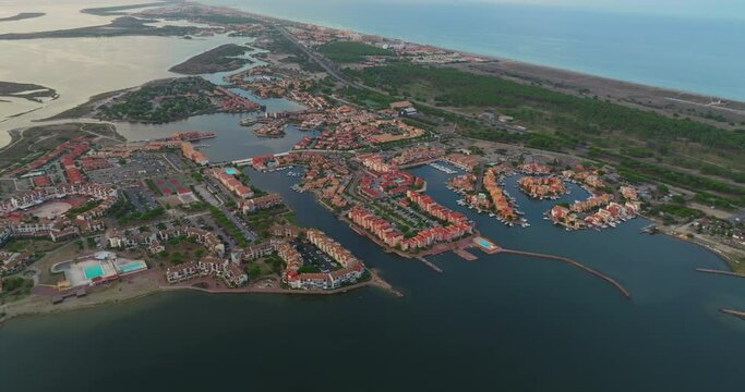 Aerial view of Port Leucate with mediterranean sea in background sunset France, Aude, Occitanie