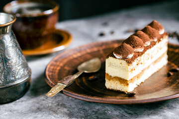 Italian dessert tiramisu close-up. Low key,