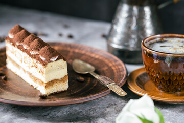 Italian dessert tiramisu close-up. Low key,