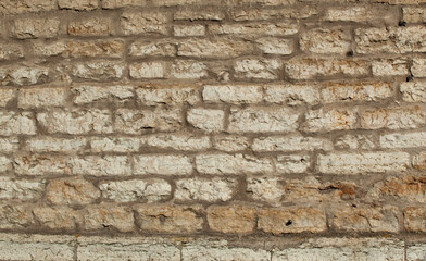 An ancient wall made of gray old bricks in Tallinn. Texture
