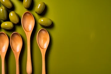 Foto op Plexiglas Olives in olive oil on a wooden spoon on a green background. Generated AI © Stan