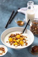 Homemade yogurt with granola and mango