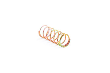 Golden helical coil spring isolated on white background, Old coil spring
