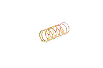 Golden helical coil spring isolated on white background, Old coil spring