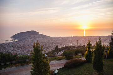 View from the mountains on Alanya, Turkey. Cityscape with sunset over the sea.