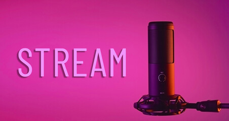 A studio condenser microphone with STREAM written on a colored background.