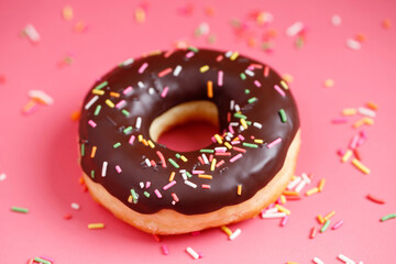 assorted donuts with chocolate frosting, topping sprinkles donuts Colorful variety and Variety of...