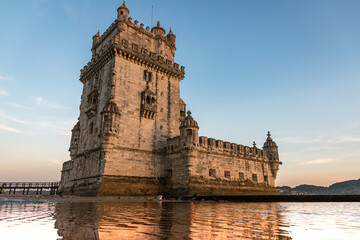belem tower in autumn at sunset