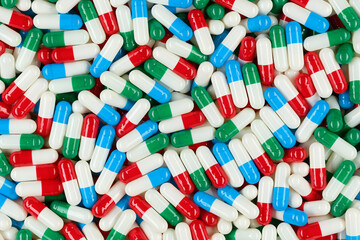 Multicolour capsules top view. Pills and drugs. Pharmaceutical Industry