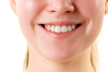 Obraz premium Cropped photo of young smiling with teeth female face, lips without lipstick. Natural gloss of lips and woman's skin. Increase in lips, cosmetology.