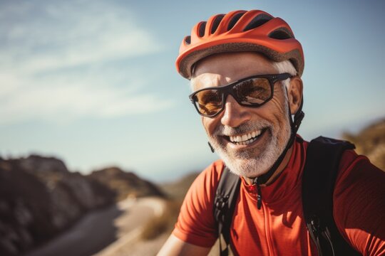 An older man wearing a helmet and sunglasses. This picture can be used to depict safety, outdoor activities, or a motorcycle enthusiast.