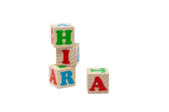 Children's wooden cubes with blue, red and green letters in the shape of a tower stand one on top of the other and lie side by side. PNG. For text. High quality photo.