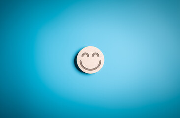 Happy face icon on wooden circle label for experience survey services and products review concept....