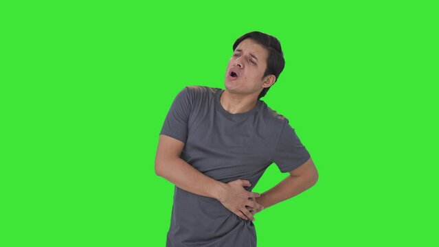 Indian man suffering from back pain Green screen