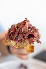 Large pastrami sandwich piled high with meat. Excessive Pastrami Sandwich