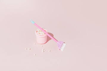 Minimal, aesthetic cleaning concept, pastel pink creative arrangement, broom, bucket and pearls. 