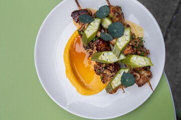 a plate filled with vegetables sitting on top of a table