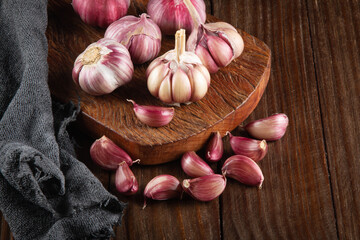 Closeup Garlic clove and bulb on wooden background top view