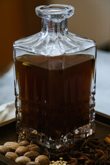 Wassail with spices or mulled cider with Cha&iuml; spices in a vintage glass