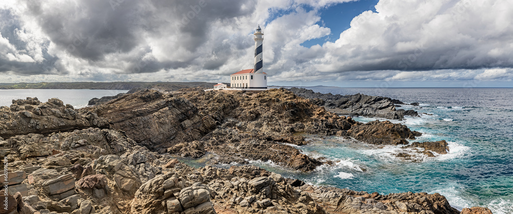 Wall mural Panoramic view of Favaritx Lighthouse at north coast of Menorca (Balearic Islands)