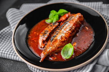 mackerel tomato sauce fresh canned fish seafood eating cooking appetizer meal food snack on the...
