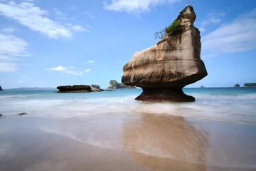 Fotobehang beach and rocks long exposure © Nicolas