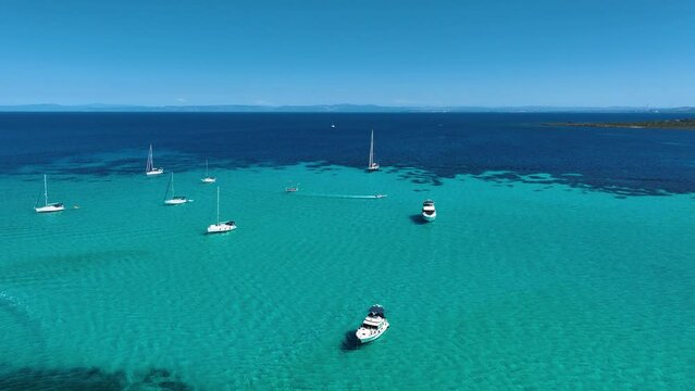 Drone view of a sailing yacht. Luxury transportation. Vacationing people. Vacation and holidays. Summer time for sea travel. The sea bay. Footage for background and wallpaper. Mediterranean Sea.
