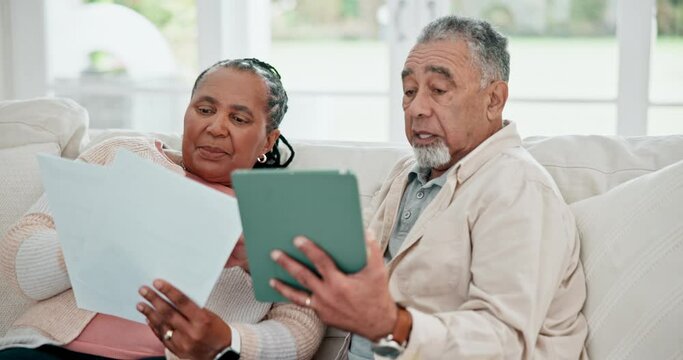 Senior couple, documents and online with home bills, financial planning and debt or loan application on tablet. Elderly people on sofa with digital technology, paperwork and taxes report or assets