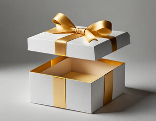 White present box open with blank golden bottom box or blank opened gift box tied with gold ribbon and bow isolated on grey white background with shadow minimal conceptual