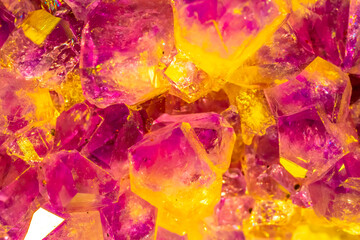 Naklejka na ściany i meble Multi-colored crystal mineral stone. Gems. Mineral crystals in the natural environment. Texture of precious and semiprecious stones. shiny surface of precious stone