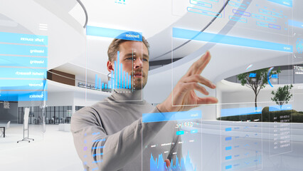 Handsome Man Standing in Futuristic Virtual Space, Interacting with an Augmented Reality Hologram...