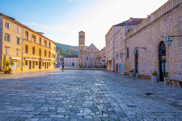 Main square in old medieval town Hvar. Hvar is one of most popular tourist destinations in Croatia in summer.  - obrazy, fototapety, plakaty