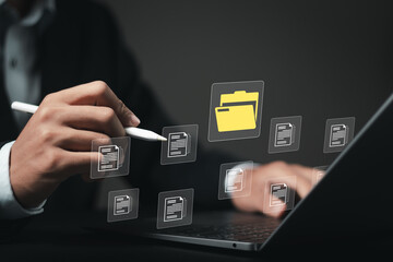 Document management system (DMS) technology, businessman use laptop with database to store files document data digital. file storage process with security. information technology concept.