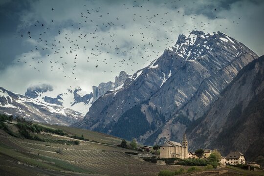 Moody atmosphere landscape view of the Saint-Severin church in Conthey Wallis