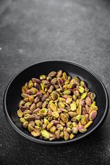 pistachios peeled nut healthy eating cooking appetizer meal food snack on the table copy space food background rustic top view