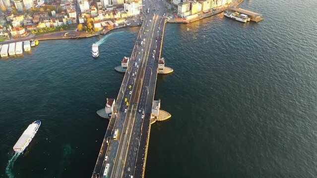 Aerial view of Galata Bridge from drone. Land and sea traffic. Istanbul Turkey.