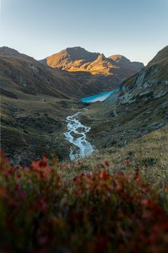 Stream winding through the valley to the Moiry lake