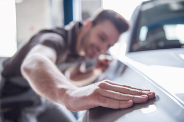 Handsome auto service worker