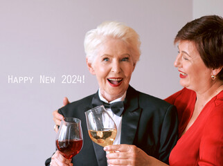 Two beautiful stylish mature senior women celebrating new year. Fun, party, style, celebration concept