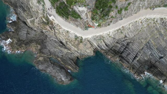 Europe, Italy, Liguria, Cinque Terre - Drone aerial view of Riomaggiore - Walk of love ( Via dell'Amore )  popular tourist attraction for tourists from all over the world Unesco Heritage 