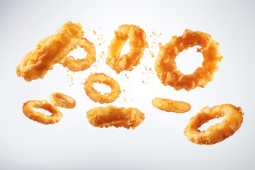 A delectable serving of crispy fried onion rings, levitating to emphasize their delicious and indulgent quality, representing a classic American fast food snack.