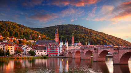 Heidelberg, Germany. Cityscape image of historical city of Heidelberg, Germany with Old Bridge Gate at beautiful autumn sunset.