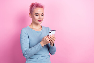 Photo of gorgeous stunning lady wear trendy clothes hold modern device texting email letter empty space isolated on pink color background