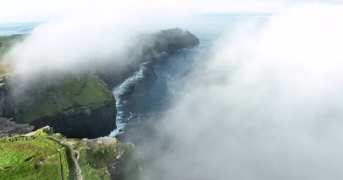 Flying in the clouds above the Cliffs of Moher