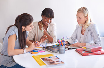 Fototapeta na wymiar Business women, teamwork and meeting of magazine, graphic design and project brainstorming or proposal. Group of people, designer and b2b manager with portfolio book, planning and advertising agency