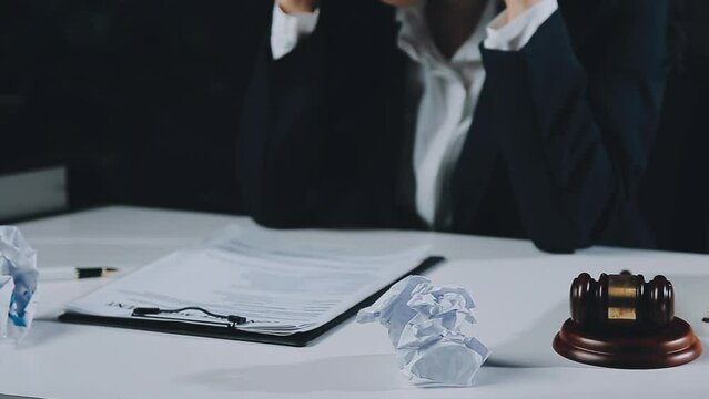 Female lawyer is stressed about losing a lawsuit. Woman stressed and worried because overworked.