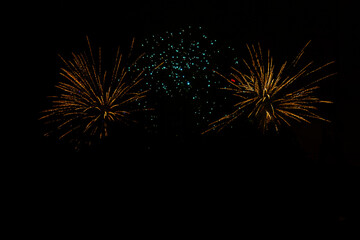 Fireworks. Colorful celebration fireworks isolated on a black sky background. From below, shot of...